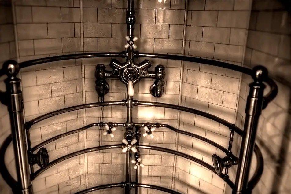 Metal water pipes along a building wall
